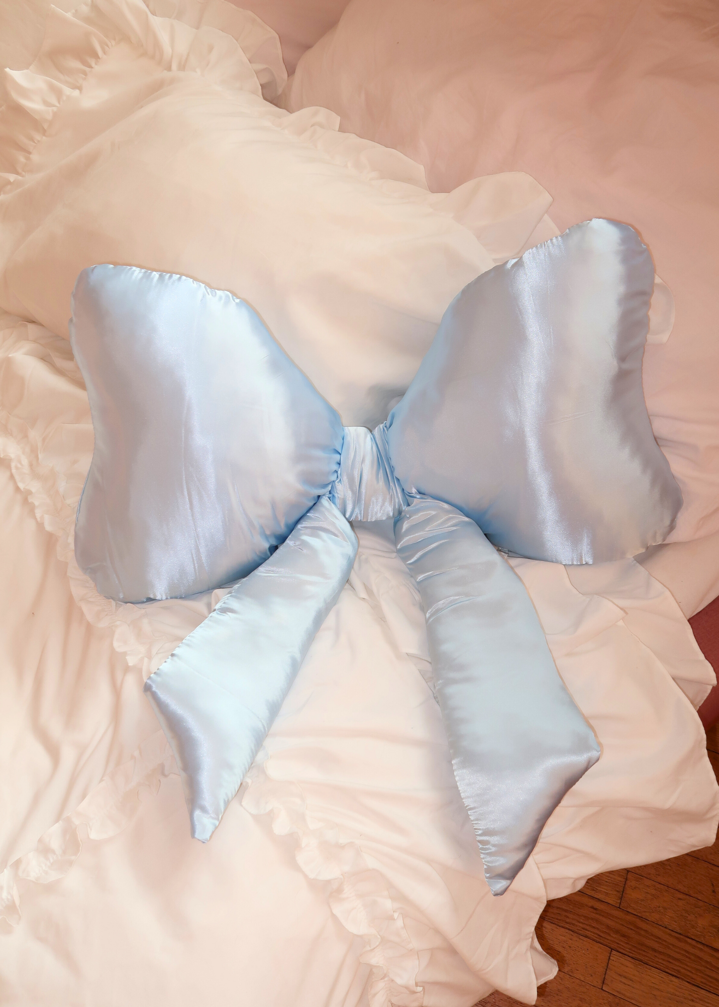 LIGHT BLUE SATIN BOW PILLOW