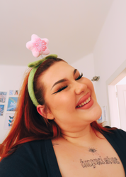 PLUSHY GREEN HEADBAND WITH A FLOWER